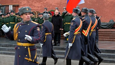 Russian President Vladimir Putin, center, attends a wreath-laying ceremony at the Tomb of the Unknown Soldier, near the Kremlin Wall, during the national celebrations of the 'Defender of the Fatherland Day' in Moscow, Russia, Wednesday, Feb. 23, 2022. The Defenders of the Fatherland Day, celebrated in Russia on Feb. 23, honors the nation's military and is a nationwide holiday. (Alexei Nikolsky, Kremlin Pool Photo via AP)