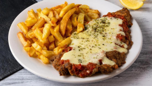 Hoy es el día de la Milanesa: la historia de un clásico que hasta Lionel Messi sigue eligiendo