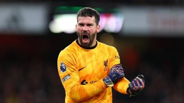 El arquero de Liverpool le confesó a Mac Allister que quiere jugar en La Bombonera.